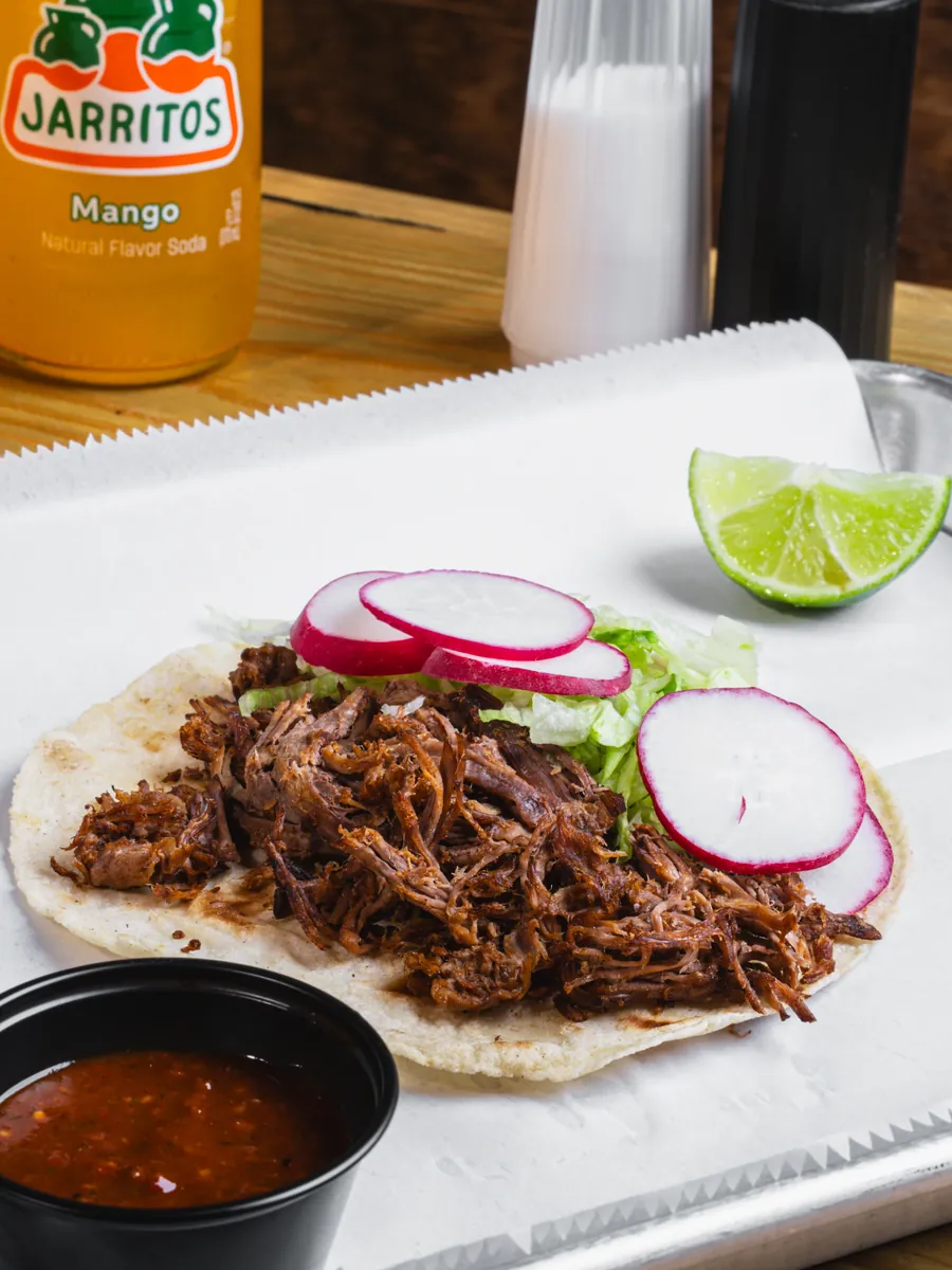 Birria tacos served with consommé